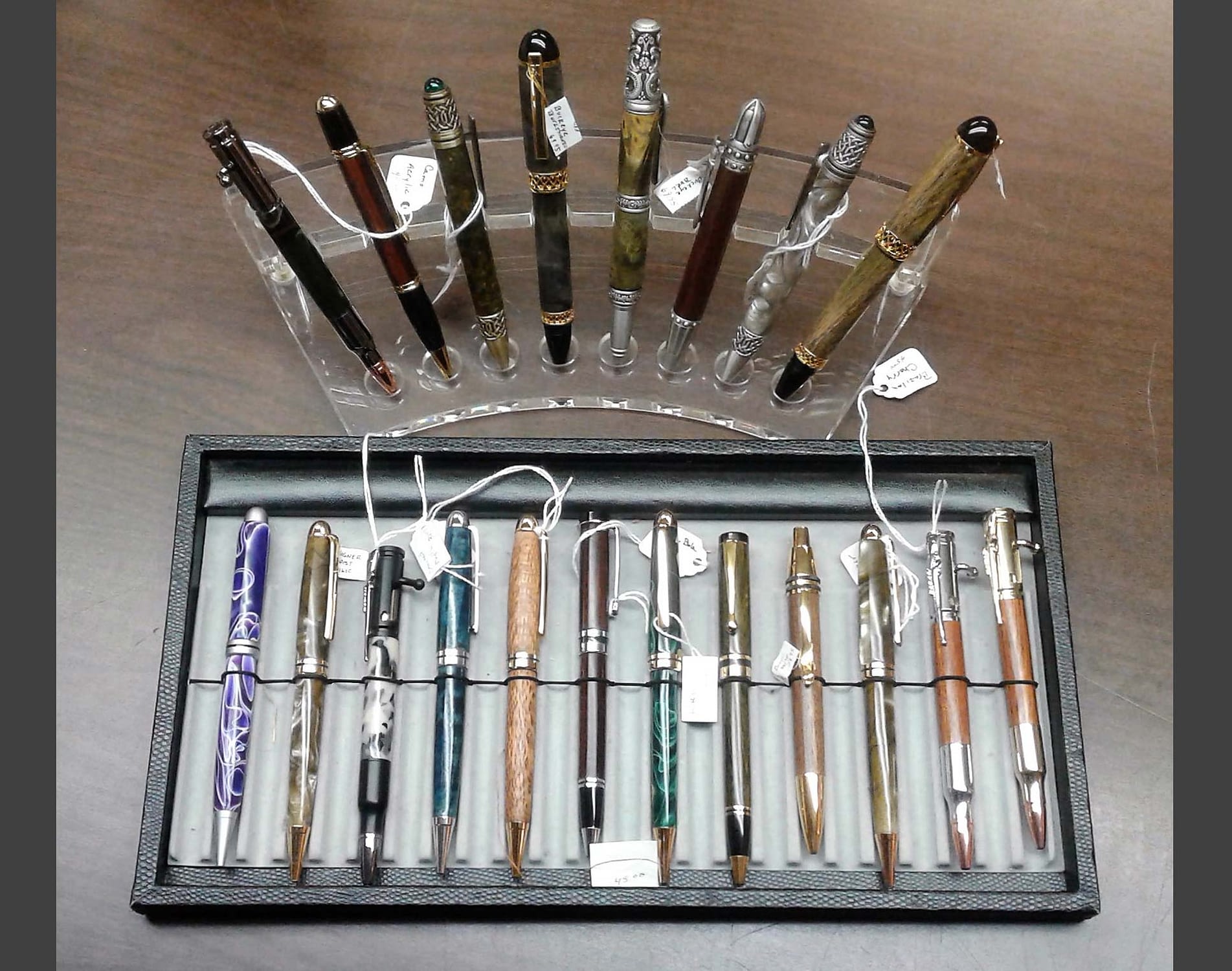 Two different devices used to hold decorative writing utensils